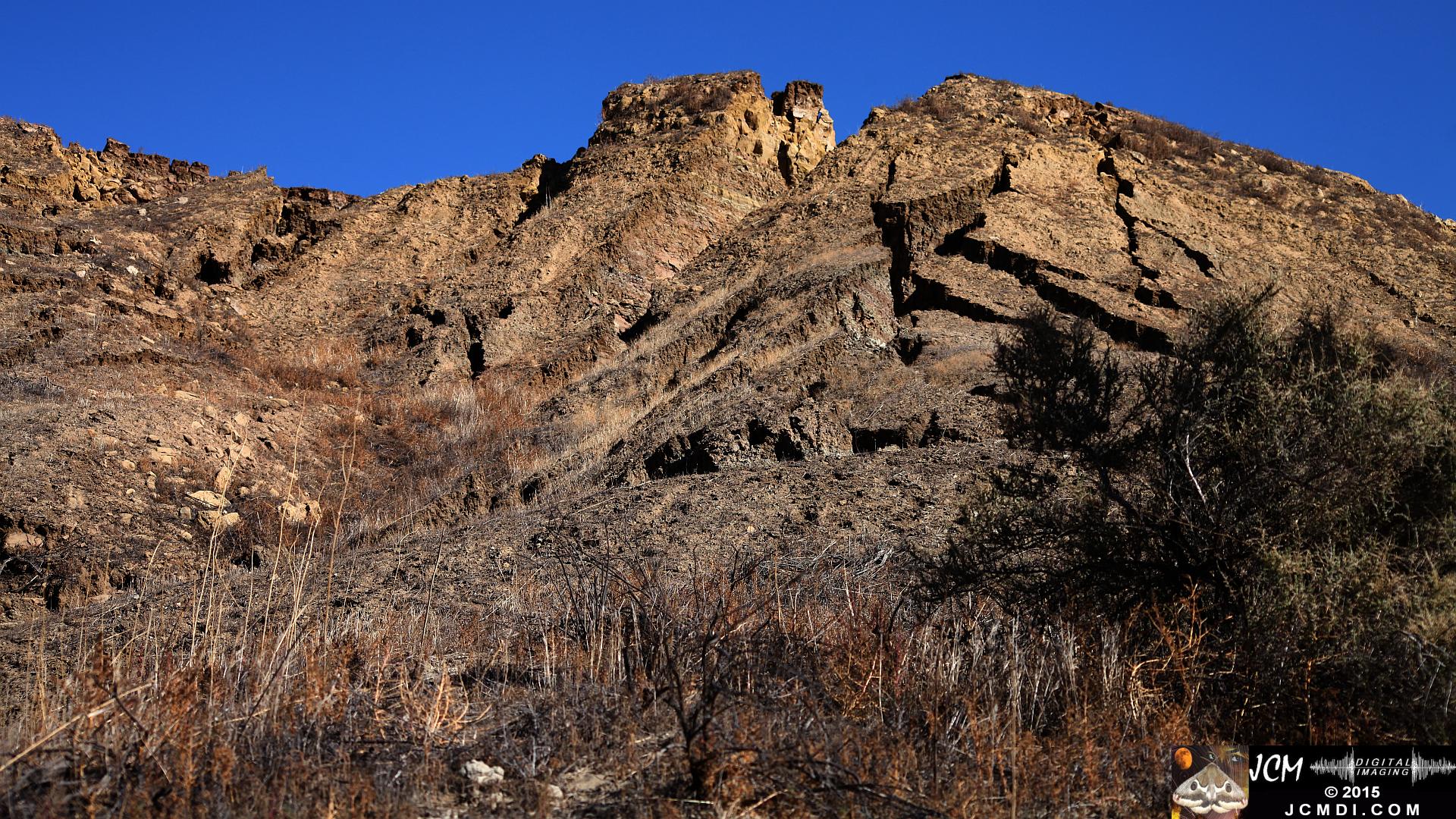 Landslide, buckled pavement, and terrain at Vasquez Canyon Road in Santa Clarita, CA filmed 11-25-2015